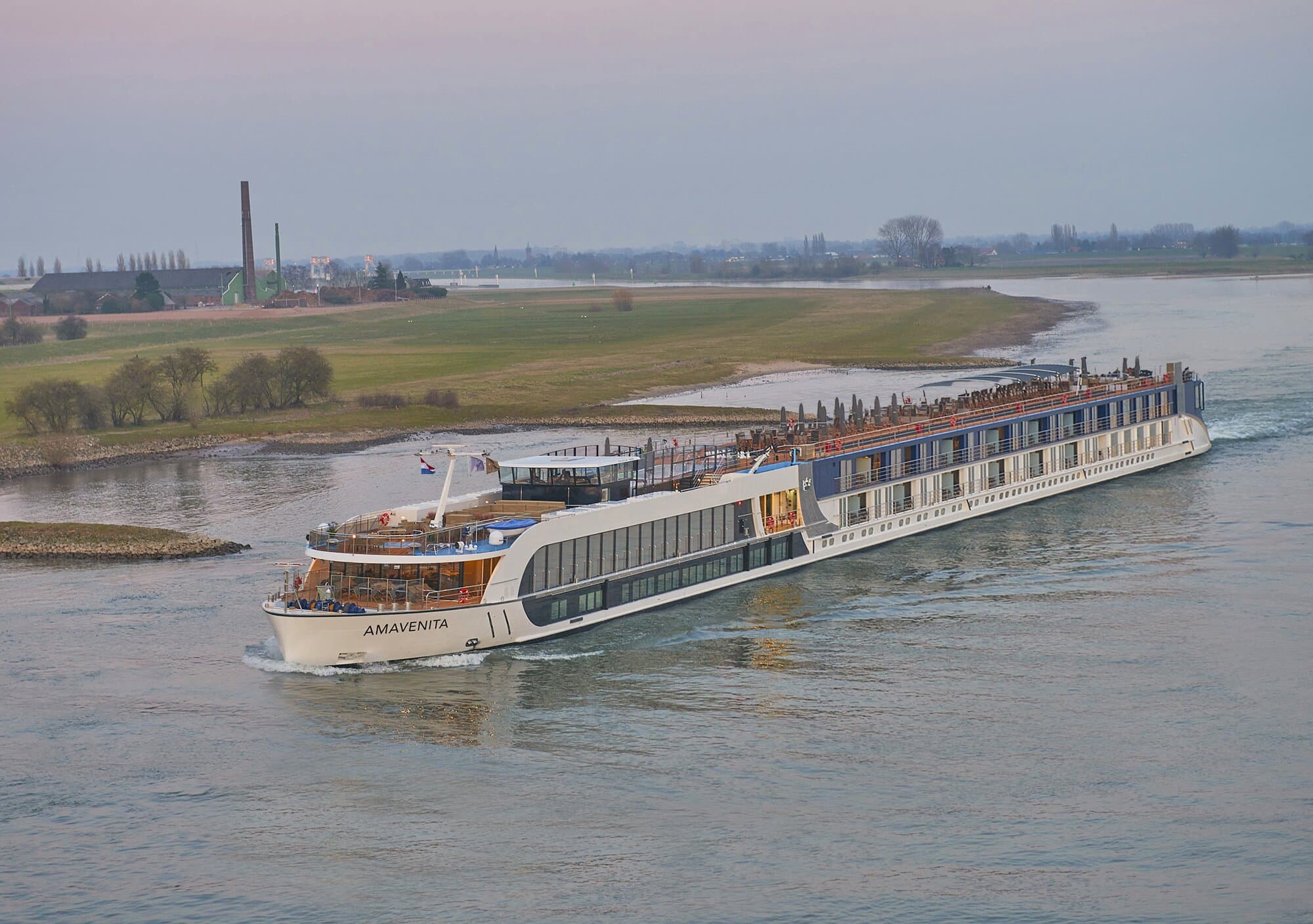 AmaVenita cruising the Rhine River through the countryside at sunset in Germany