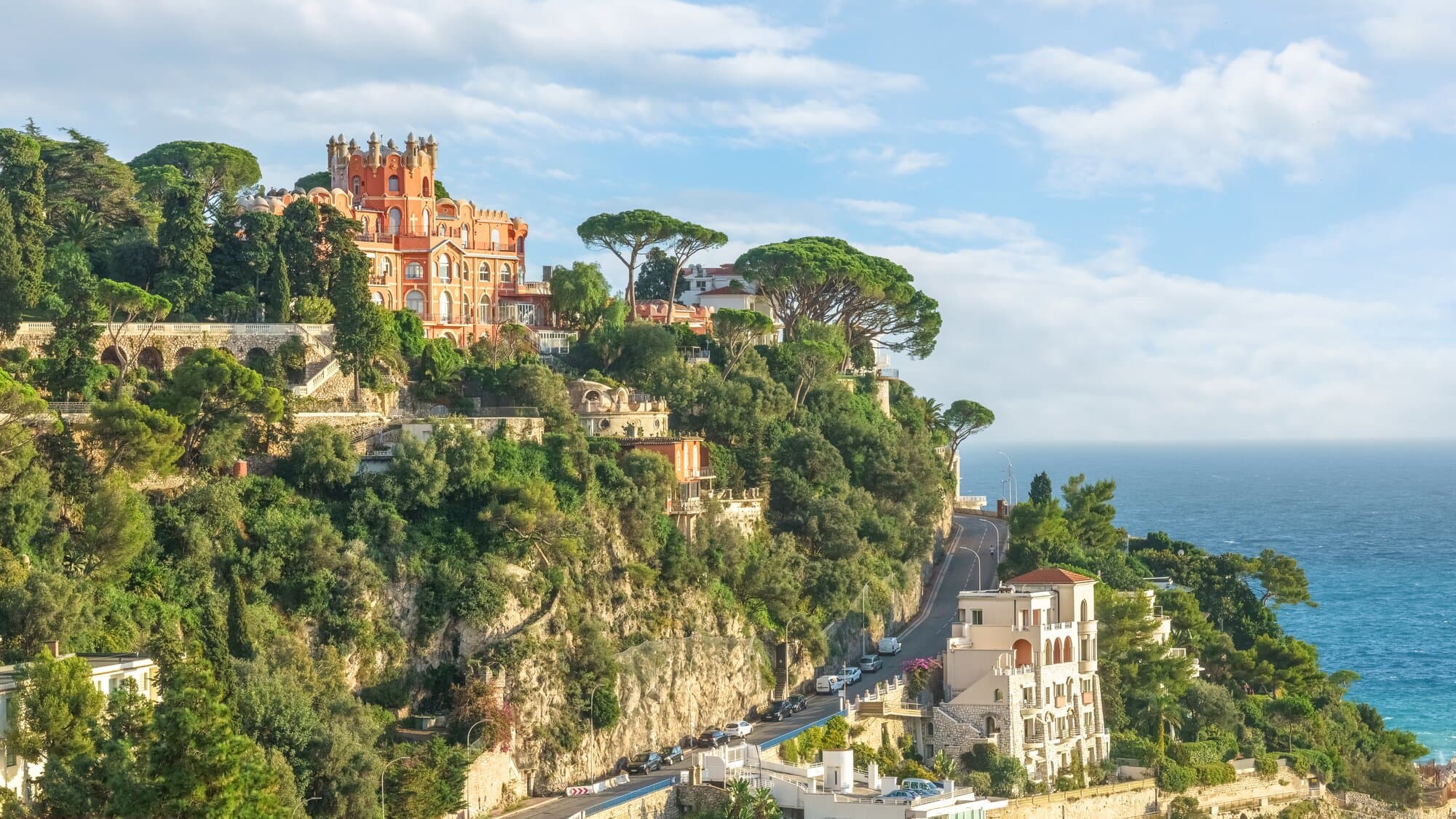 Nice France, French Riviera. Panoramic view to Nice surroundings, luxury villas, green hill and azure Mediterranean sea.