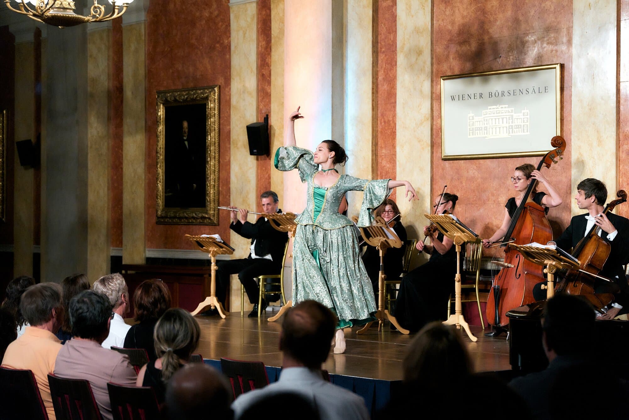Orchestra performance in Vienna with woman dancing